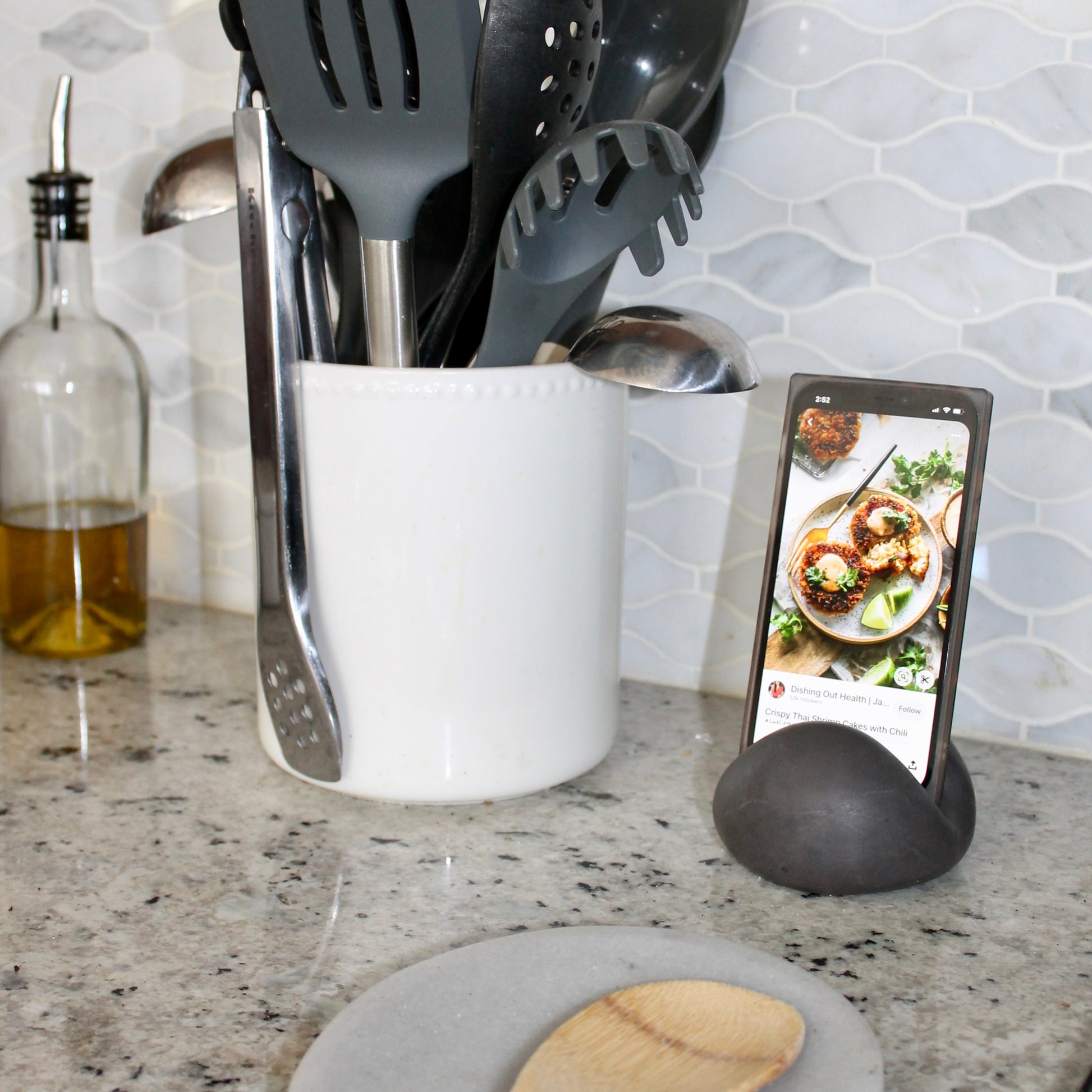 concrete phone holder for reading recipes in the kitchen