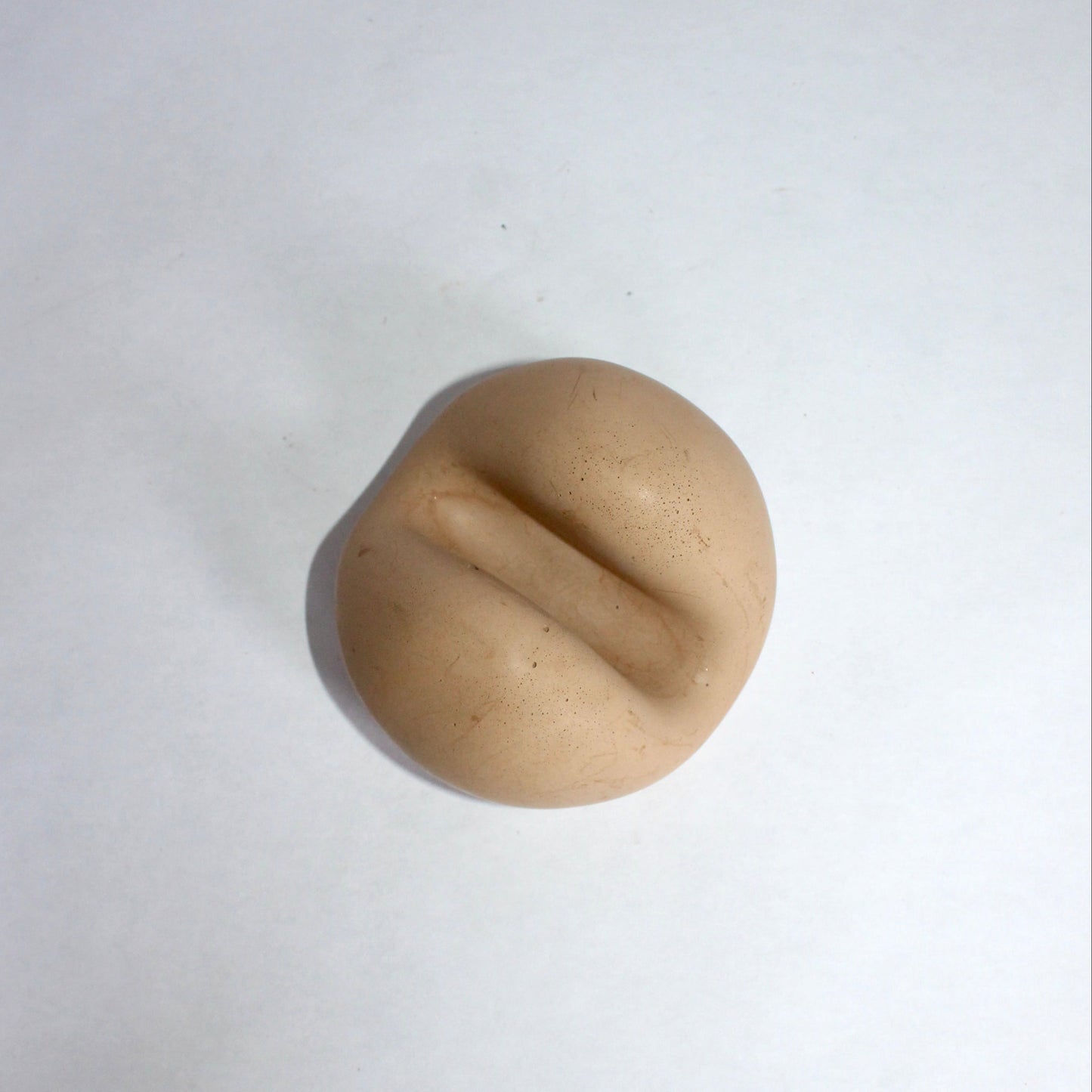 beige concrete phone holder on a white background