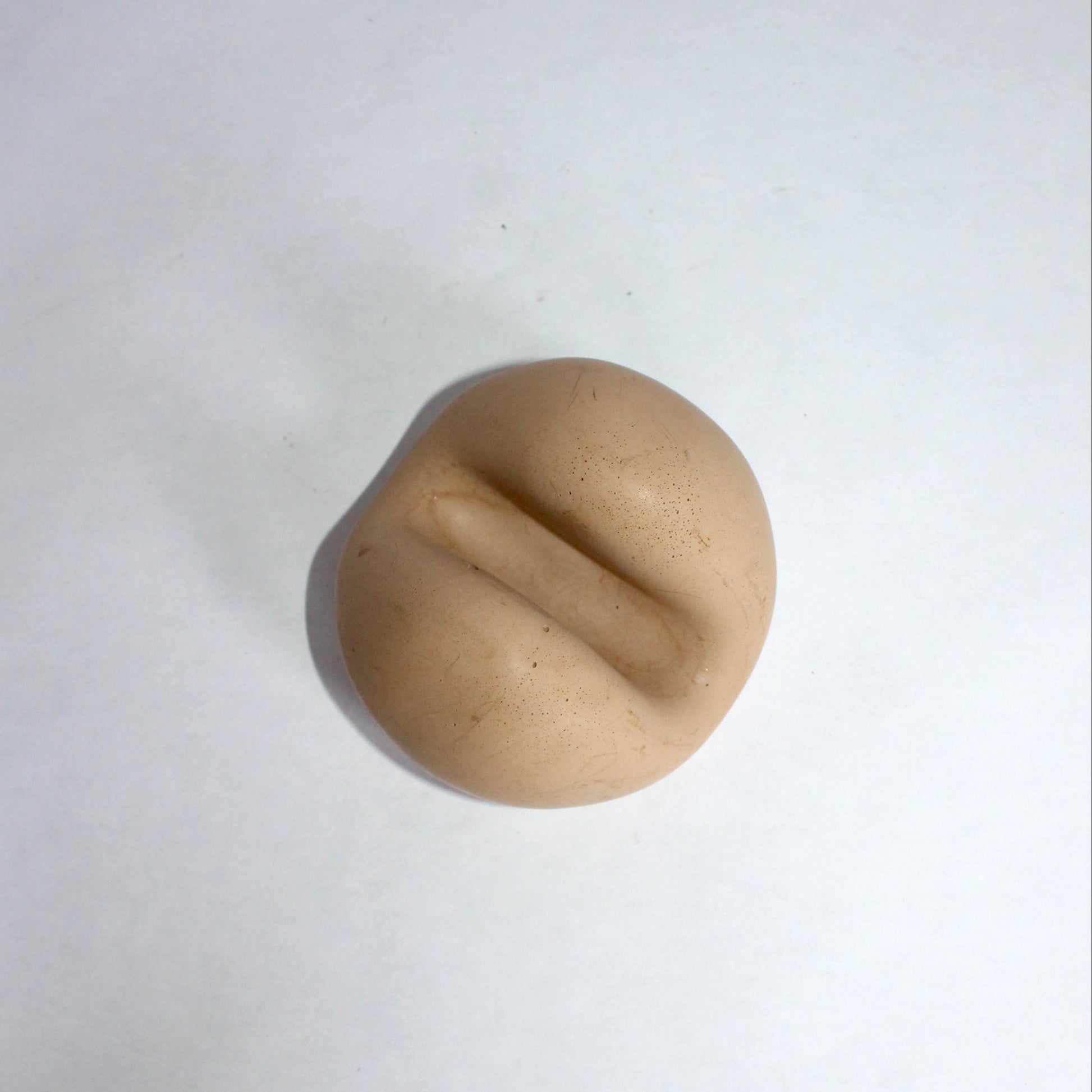 beige concrete phone holder on a white background