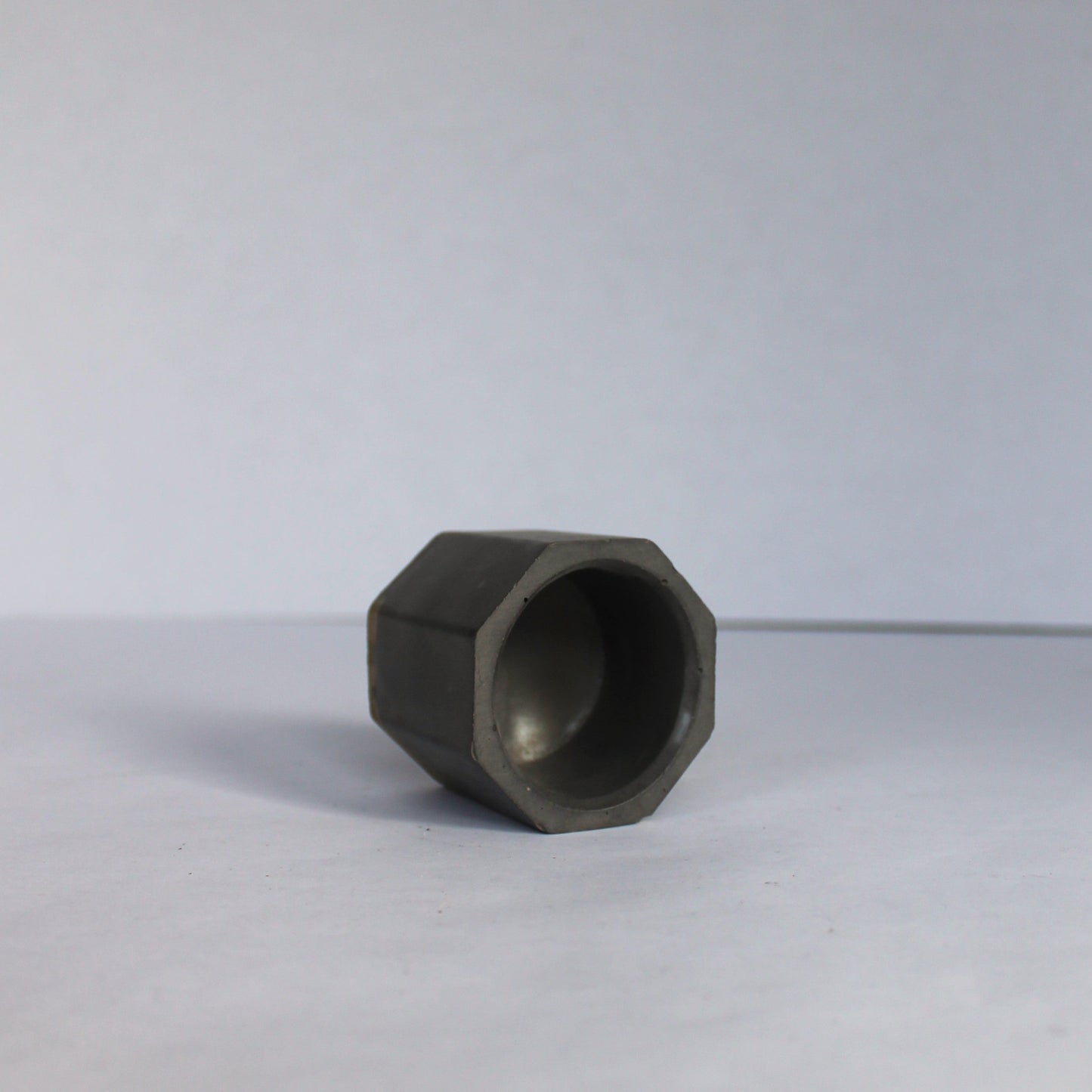 Inside view of a hexagonal concrete vessel on a white background