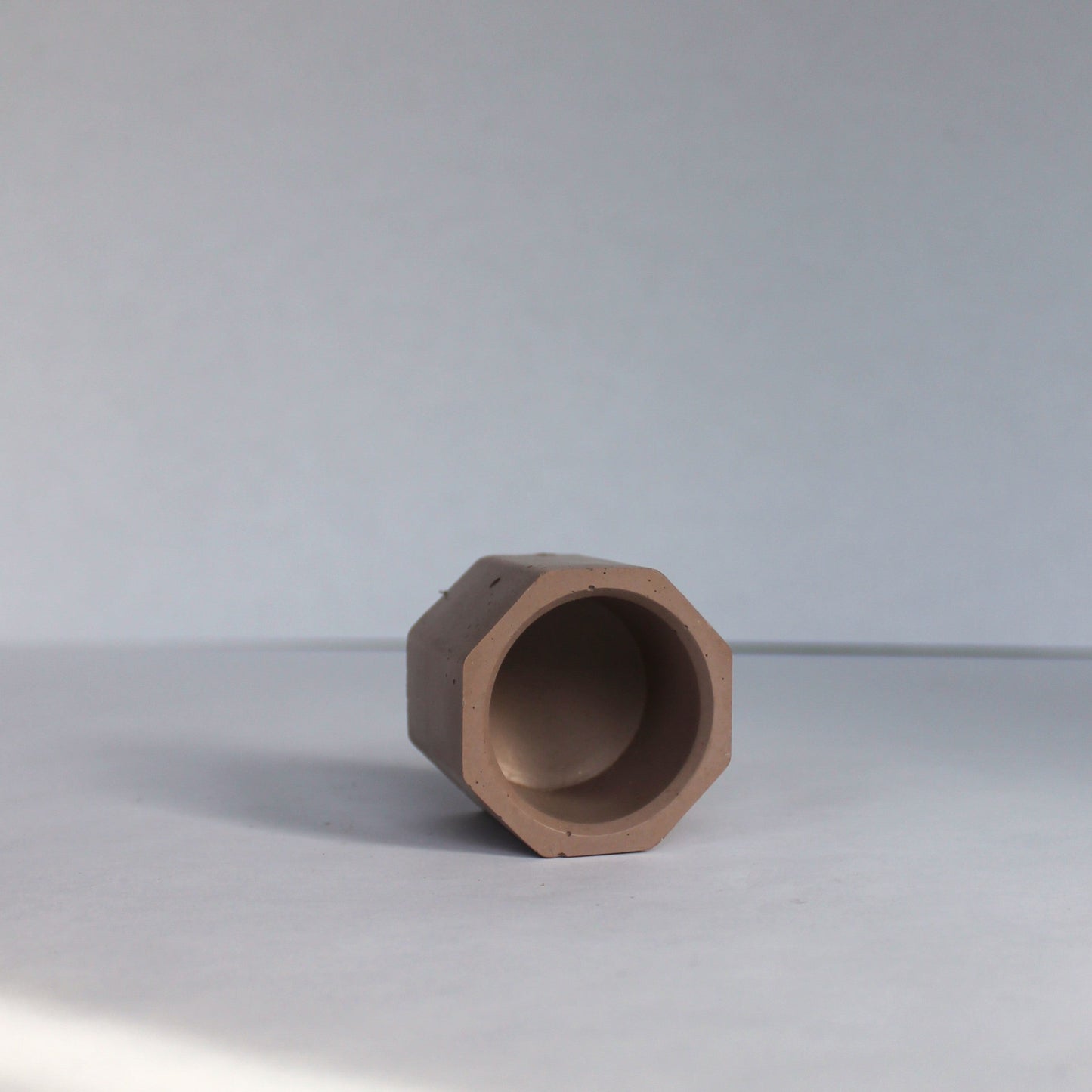 Brown geometric object on a white surface