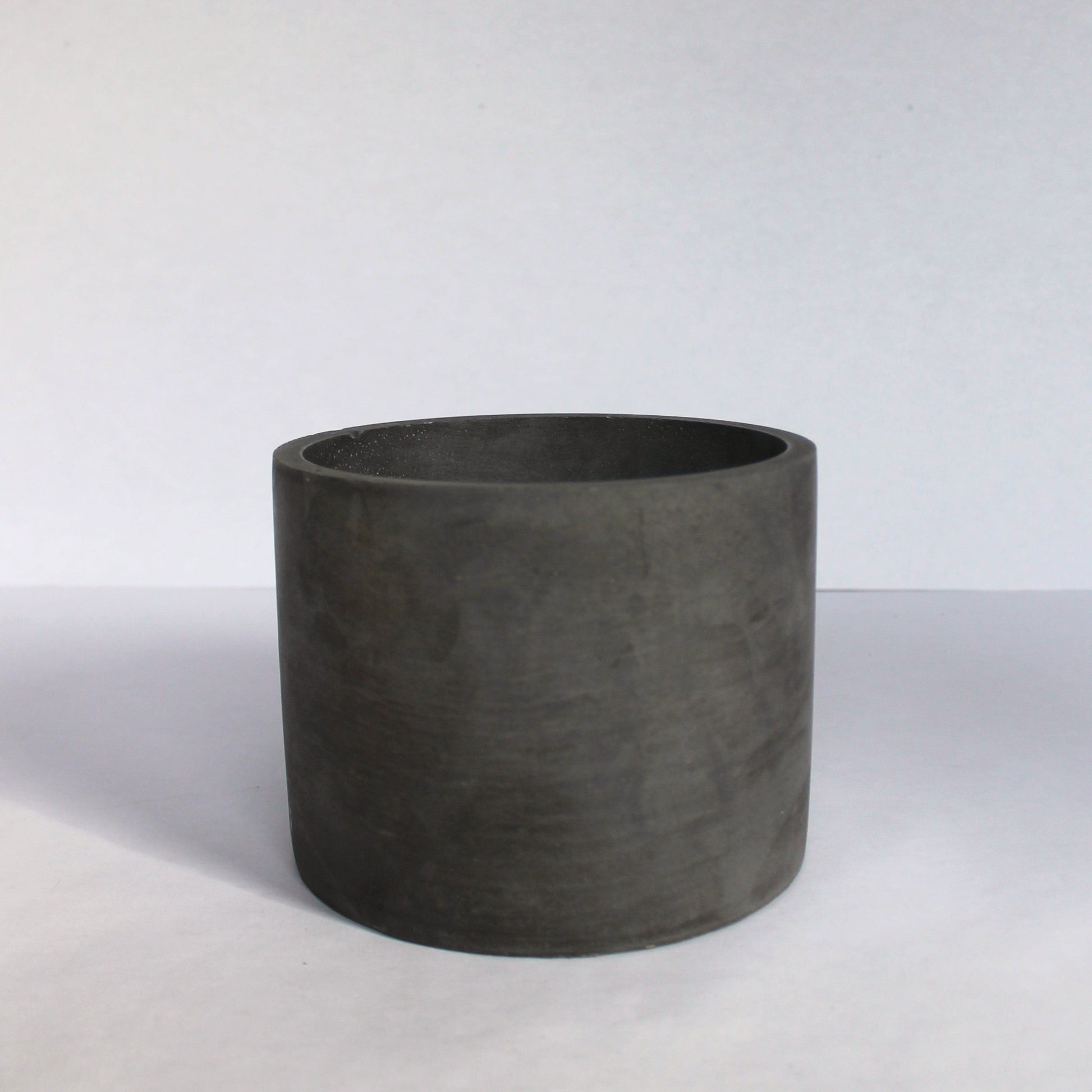 Dark Gray cylindrical pot on a white background