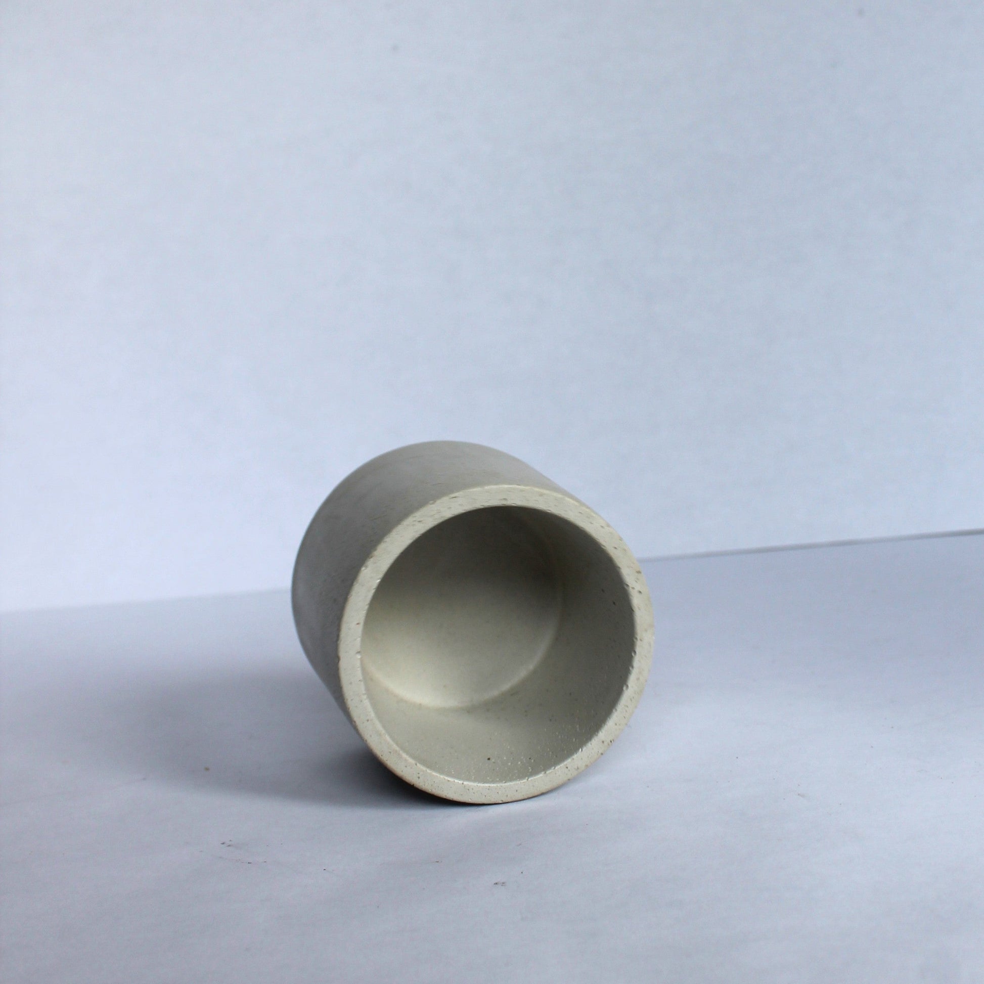 inside of concrete pot on a white background
