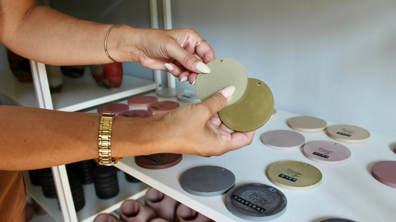 two hands showing multiple concrete color samples from the collection of color samples