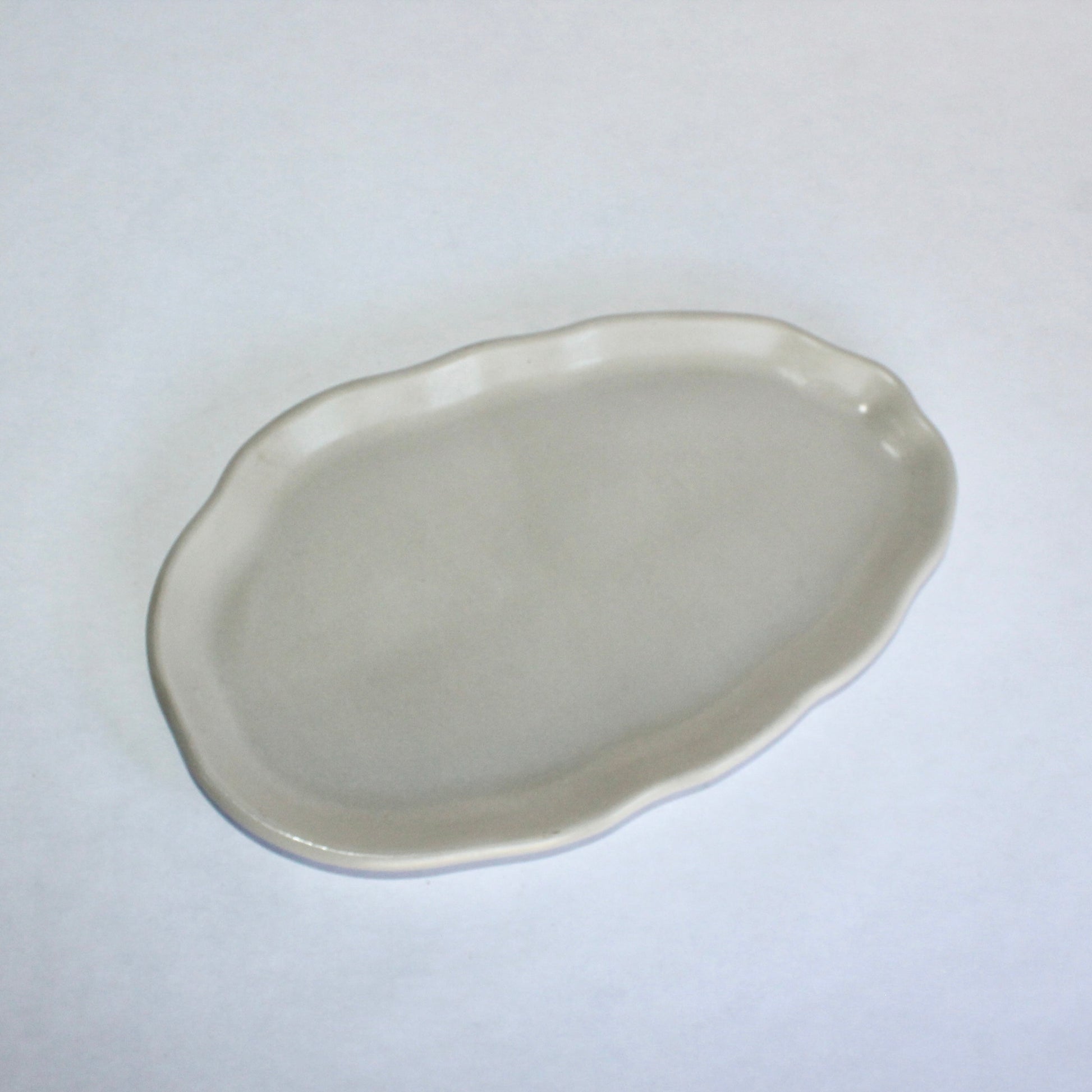 light gray decorative concrete plate on a white background