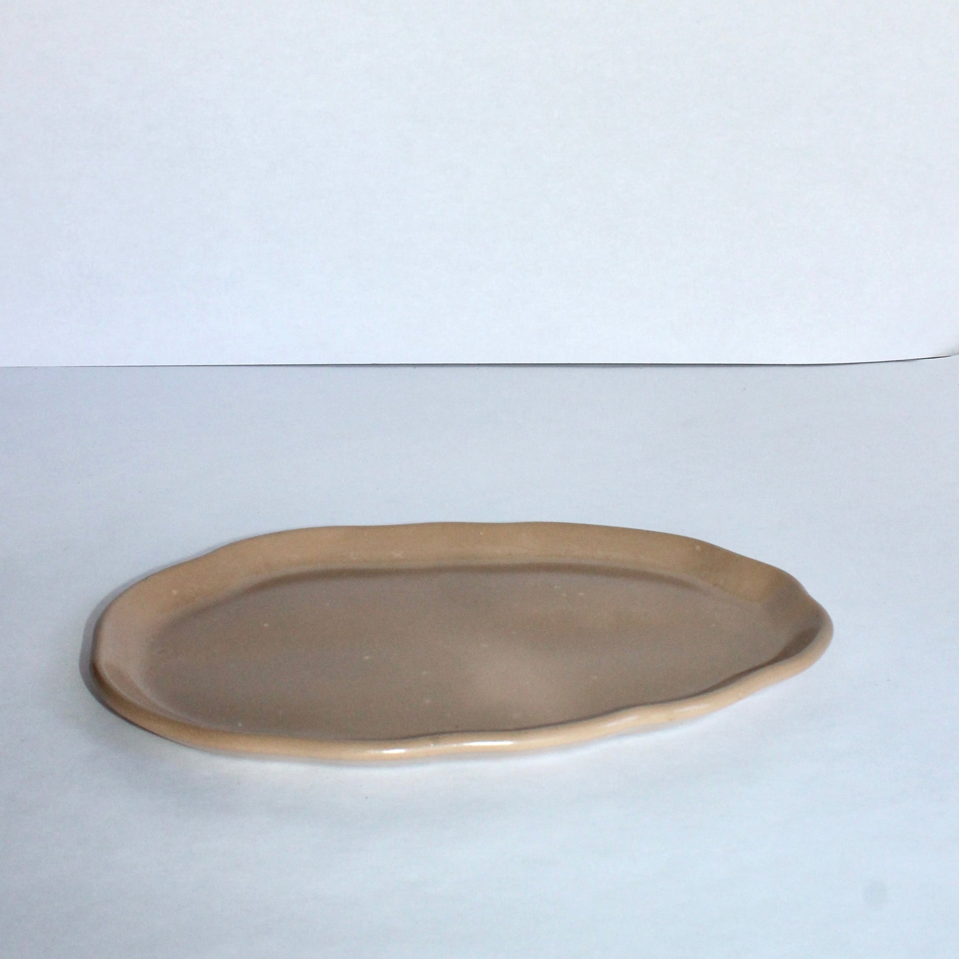 tan cement tray on a white background