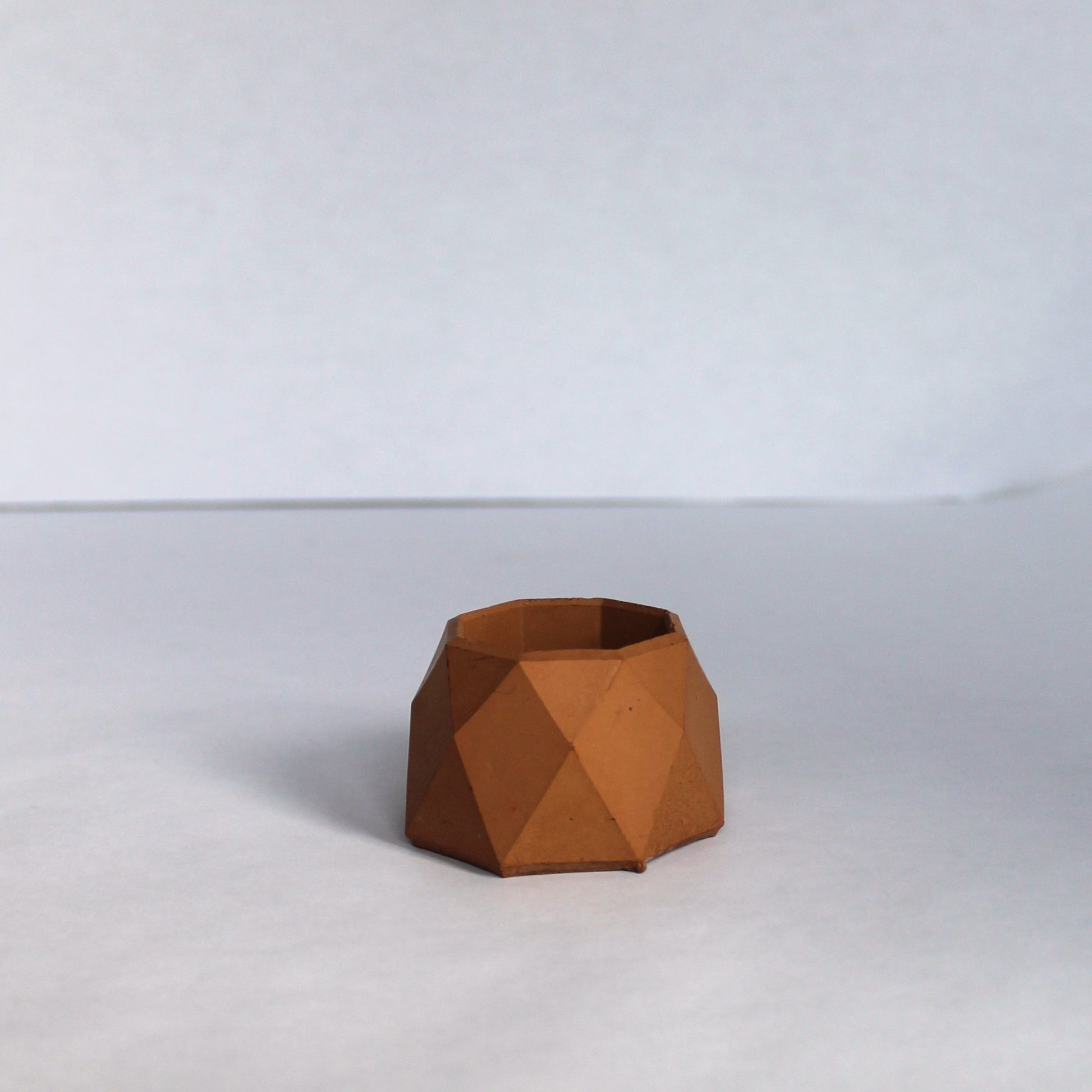 terracotta geometric small pot on a white background